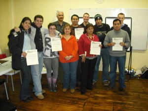 Capital Good Fund workshop participants with their graduation certificates and staff